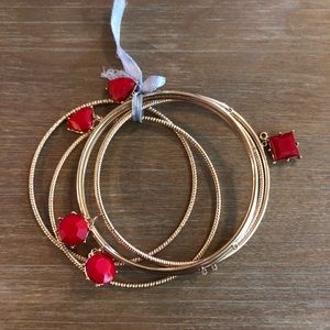 6 Gold Colored Bracelets / Some with red charms